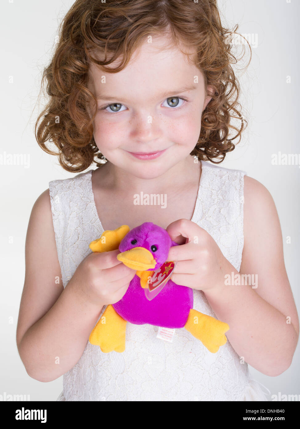 Young girl with first generation 1993 Beanie Babies - Patti the Platypus Stock Photo
