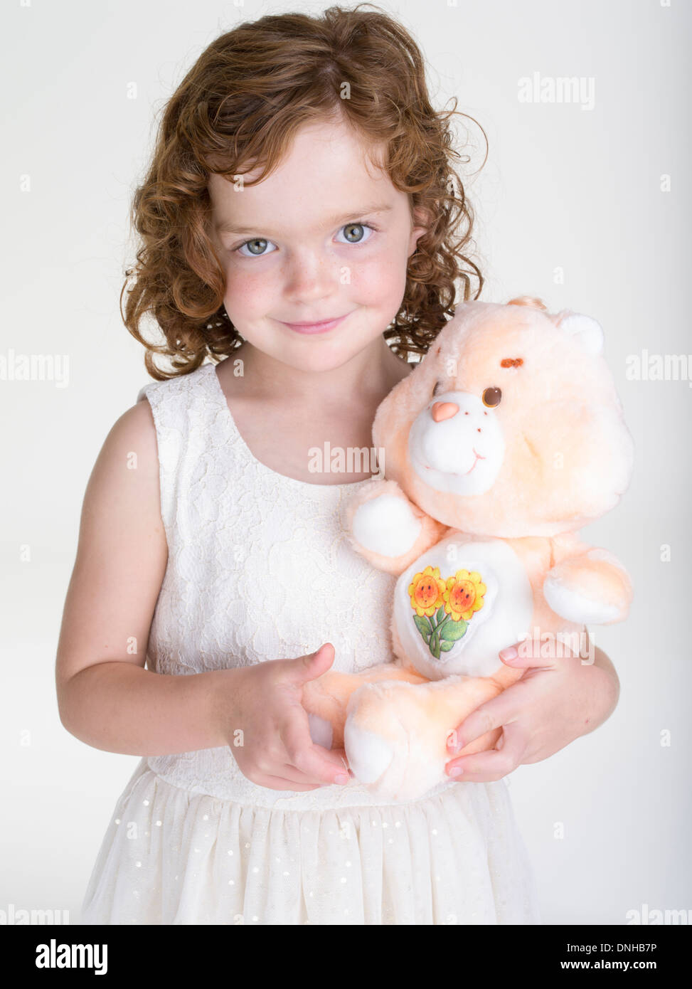 Young Girl with 1983 Friend Bear Care Bear plus teddy bear toy by Kenner Stock Photo Alamy