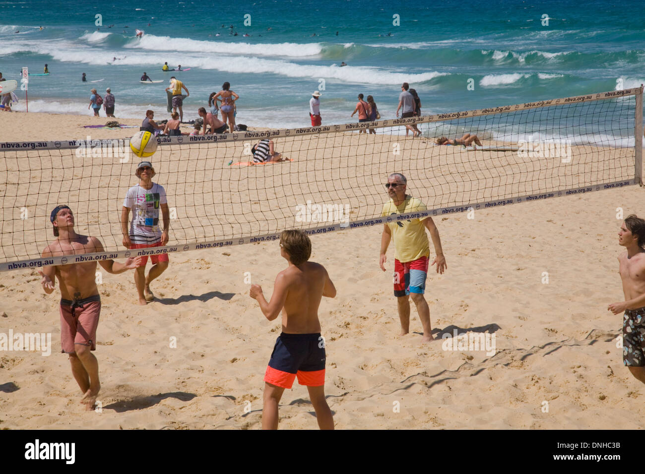 young men playing beach volleyball on manly beach in sydney,australia Stock Photo