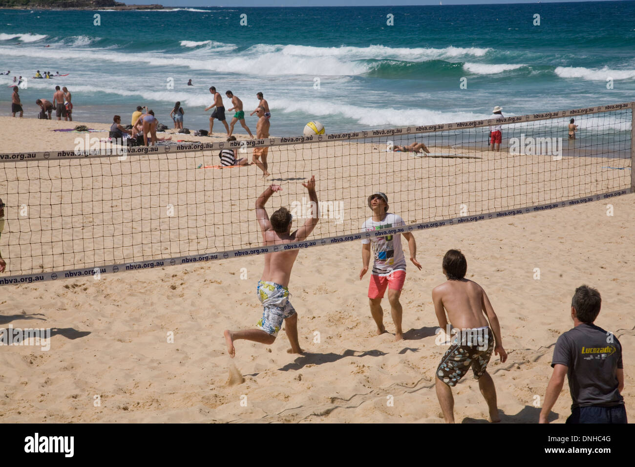 Young boys playing beach volleyball on Manly beach in Sydney,Australia Stock Photo