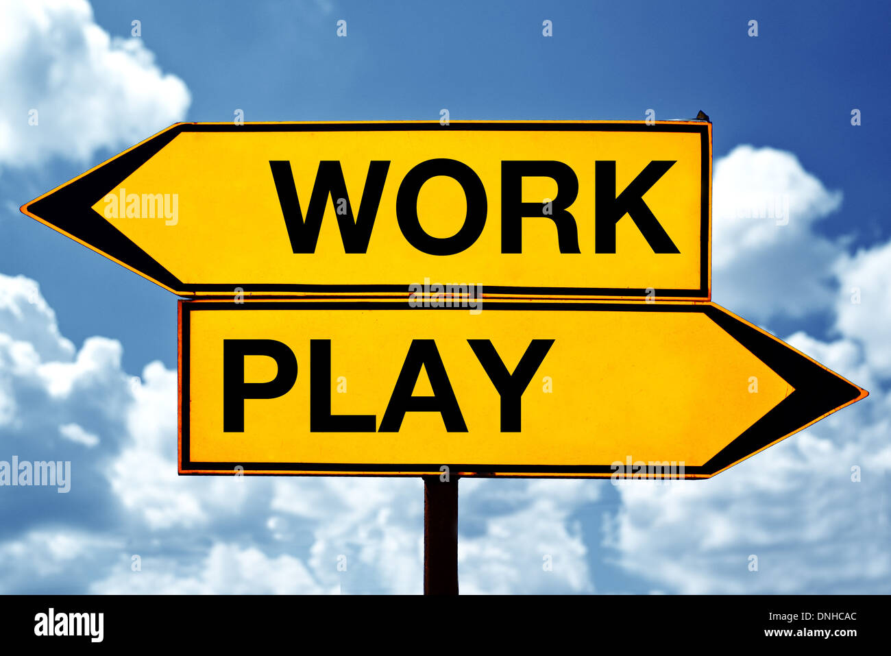 Work or play, opposite signs. Two opposite signs against blue sky background. Stock Photo