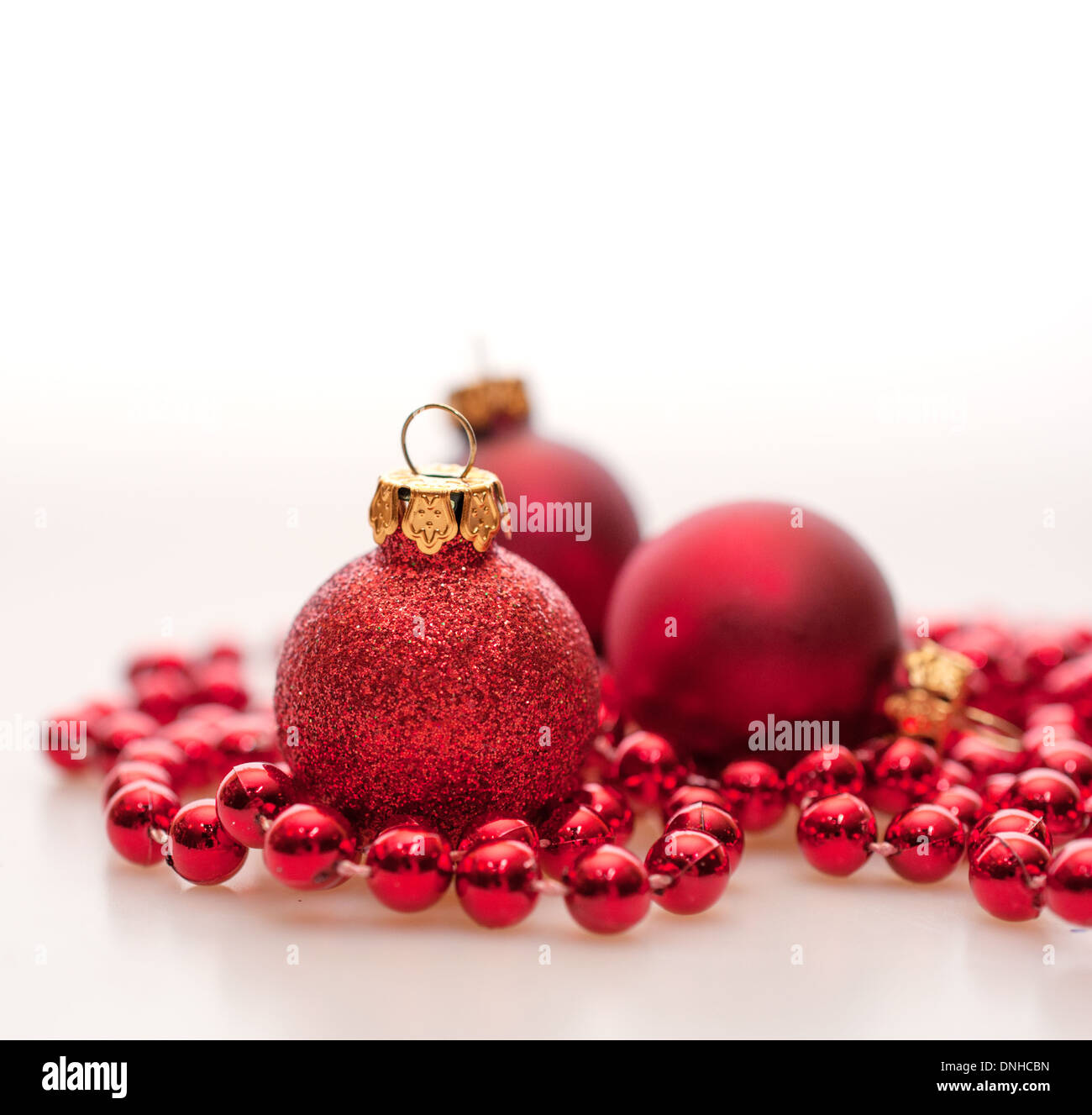 Red Christmas Baubles on White Background Stock Photo