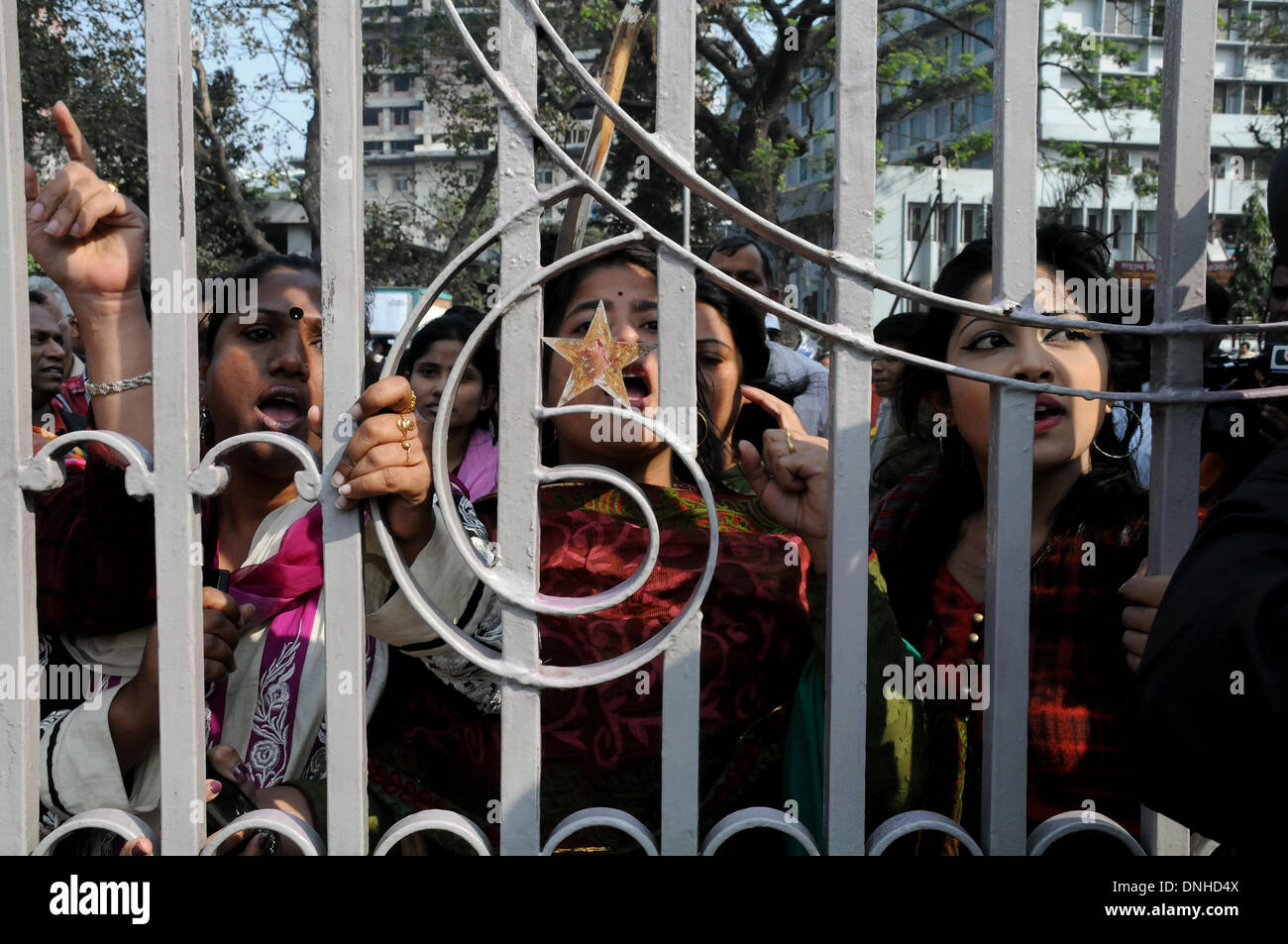 Dhaka, Bangladesh. 30th Dec, 2013. Supporters of Prime Minister Sheikh Hasina's ruling Bangladesh Awami League (AL) party shout slogans in front of the apex court during the 'March for Democracy' rally in Dhaka, Bangladesh, Dec. 30, 2013. Tensions were running high across the Bangladesh's capital Dhaka on Monday as ruling party's women activists clashed with oppostion protesters. Credit:  Shariful Islam/Xinhua/Alamy Live News Stock Photo