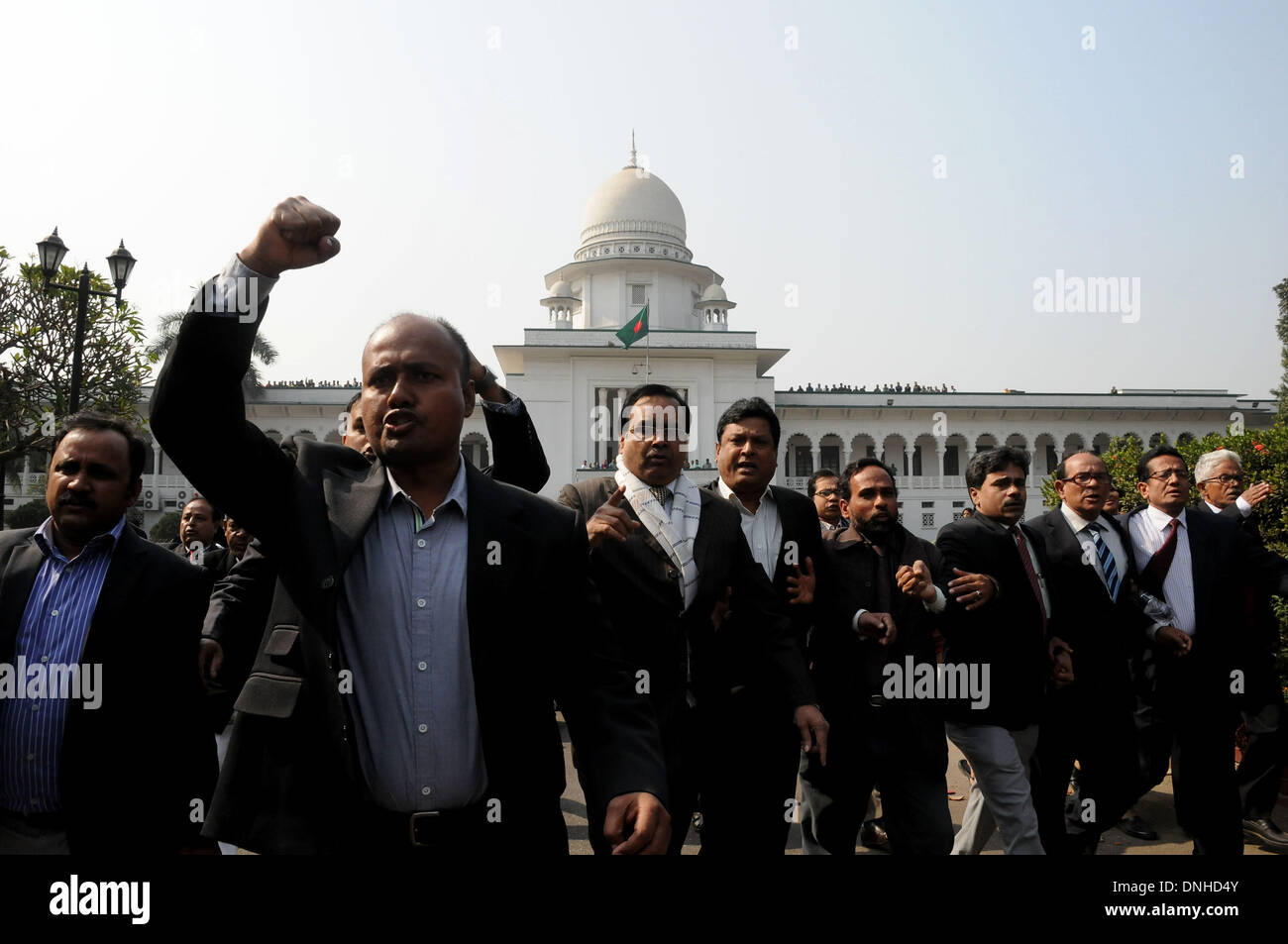 Dhaka, Bangladesh. 30th Dec, 2013. Pro-government lawyers shout slogans inside the apex court during the 'March for Democracy' rally in Dhaka, Bangladesh, Dec. 30, 2013. Tensions were running high across the Bangladesh's capital Dhaka on Monday as ruling party's women activists clashed with oppostion protestors. Credit:  Shariful Islam/Xinhua/Alamy Live News Stock Photo