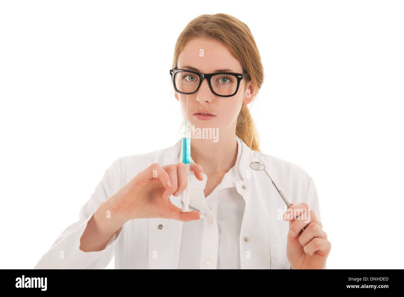 Female dentist with injection needle for anesthesia and mirror isolated