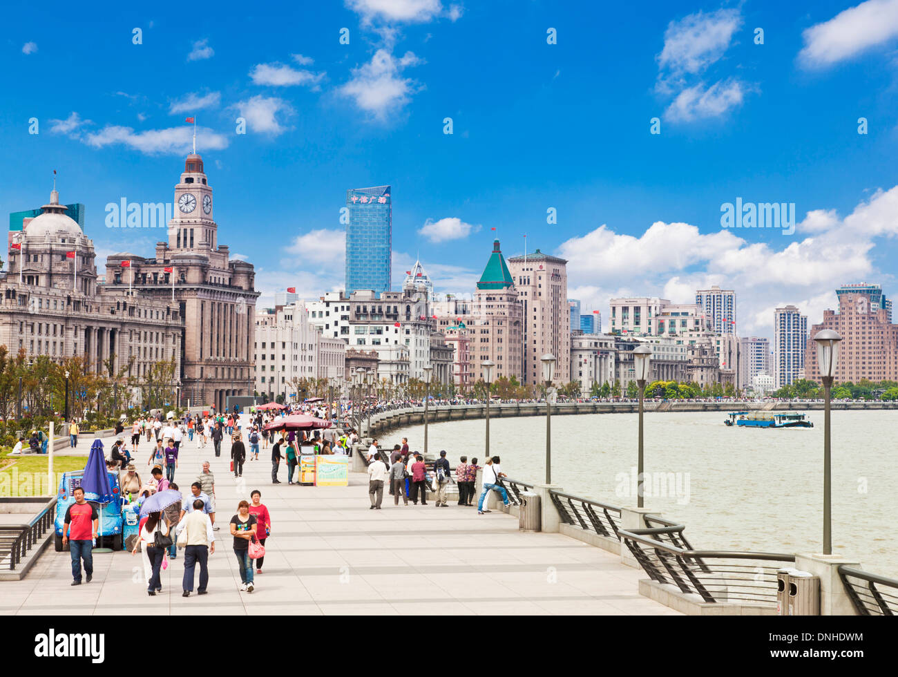 Many people walking along the Bund promenade Shanghai, Peoples Republic of China, PRC, Asia Stock Photo