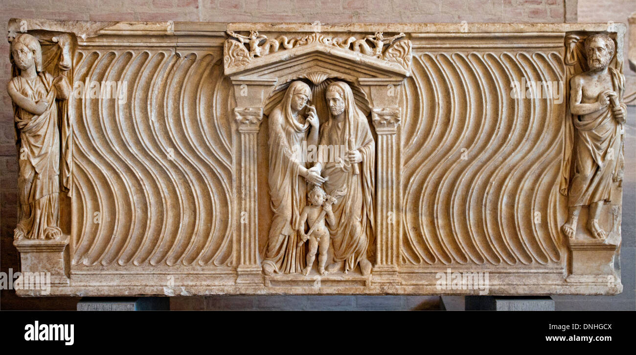 Sarcophagus married couple in the middle they share in a sacrifice corners he as  philosopher and she as a Muse 300 A.D Roman Stock Photo