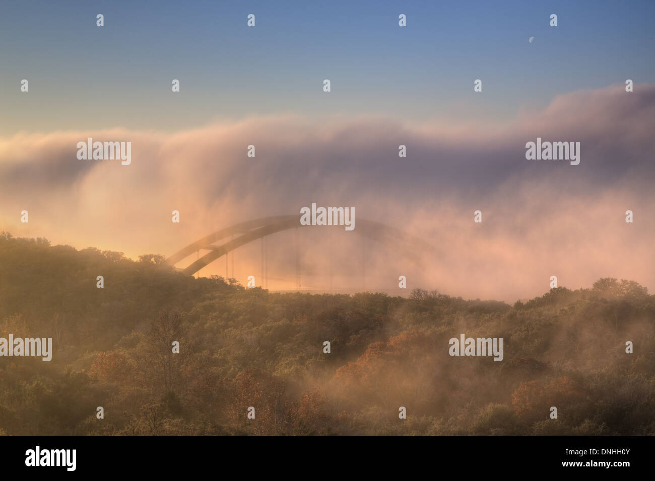 Fog rolls over Pennybacker Bridge, also known as the 360 Bridge, outside of Austin, Texas. Stock Photo