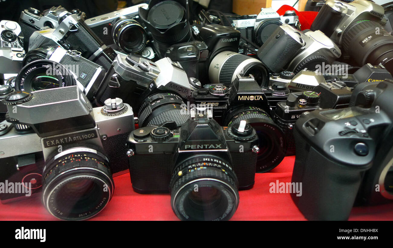 A collection of second hand FILM cameras for sale in a photographic store  window in Cardiff City Centre Wales UK KATHY DEWITT Stock Photo - Alamy