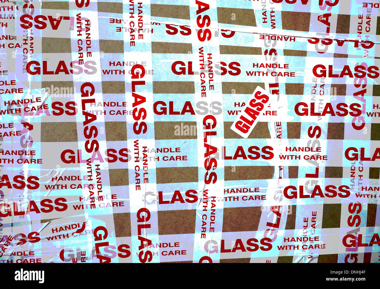 'Glass Handle with Care' tape wrapped around a fragile parcel. Stock Photo