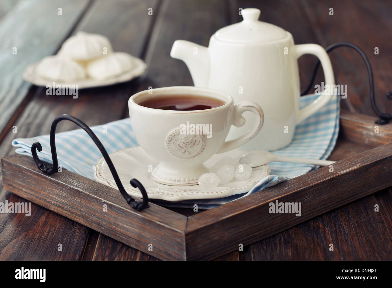 https://c8.alamy.com/comp/DNHJ8T/cup-of-tea-and-teapot-on-wooden-tray-closeup-DNHJ8T.jpg