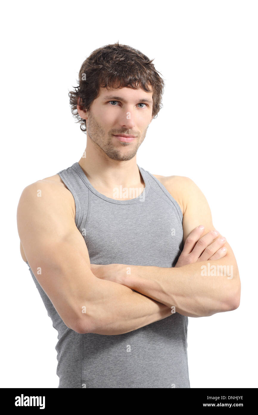 Portrait of an attractive sportsman posing with folded arms isolated on