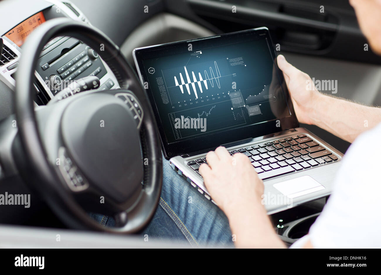 man using laptop computer in car Stock Photo Alamy