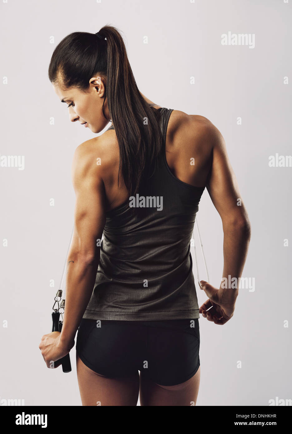 Behind the scenes of a female bodybuilder showing off her back muscles.Generative  AI 25286000 Stock Photo at Vecteezy