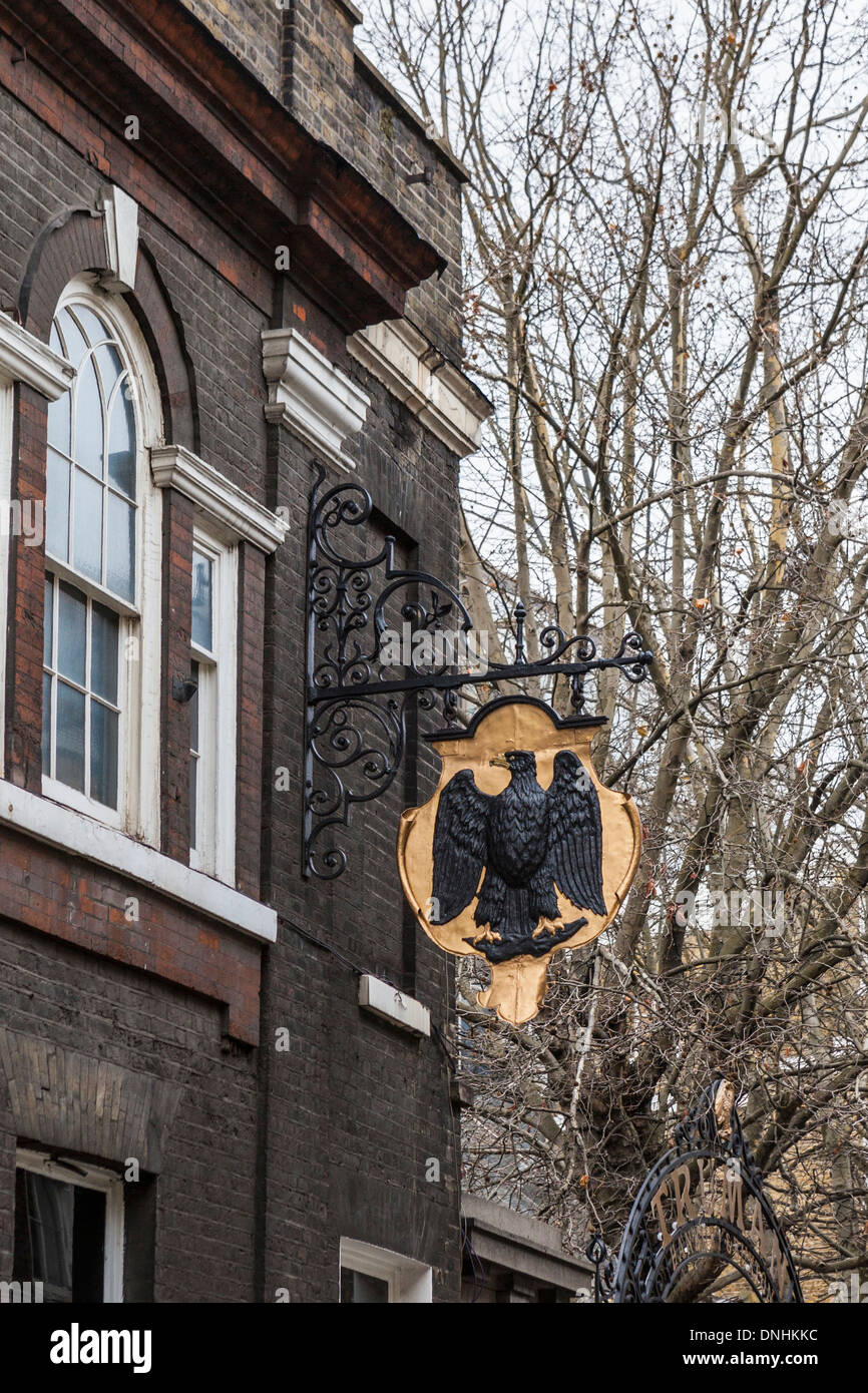 Trumans Brewery black eagle logo on sign - Brick lane, East London, UK Stock Photo