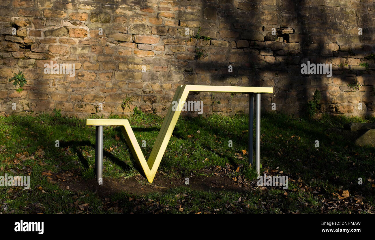 A large square-root shaped park bench. Stands in a play park - near Green's Windmill, Sneinton, England. The park contains items Stock Photo