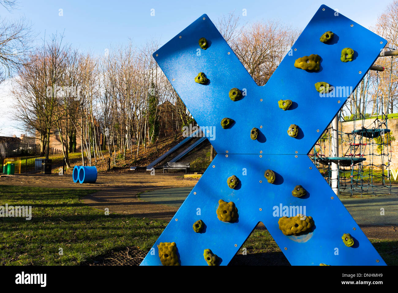 A large X-shaped climbing wall for children. Stands in a play park - near Green's Windmill, Sneinton, England. Stock Photo