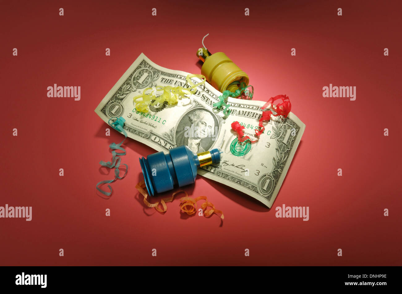 A US one dollar bill with party favors. Stock Photo