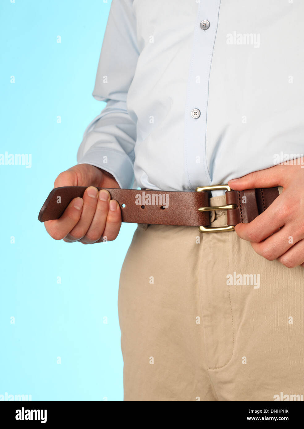 Fat man belt tightening hires stock photography and images Alamy