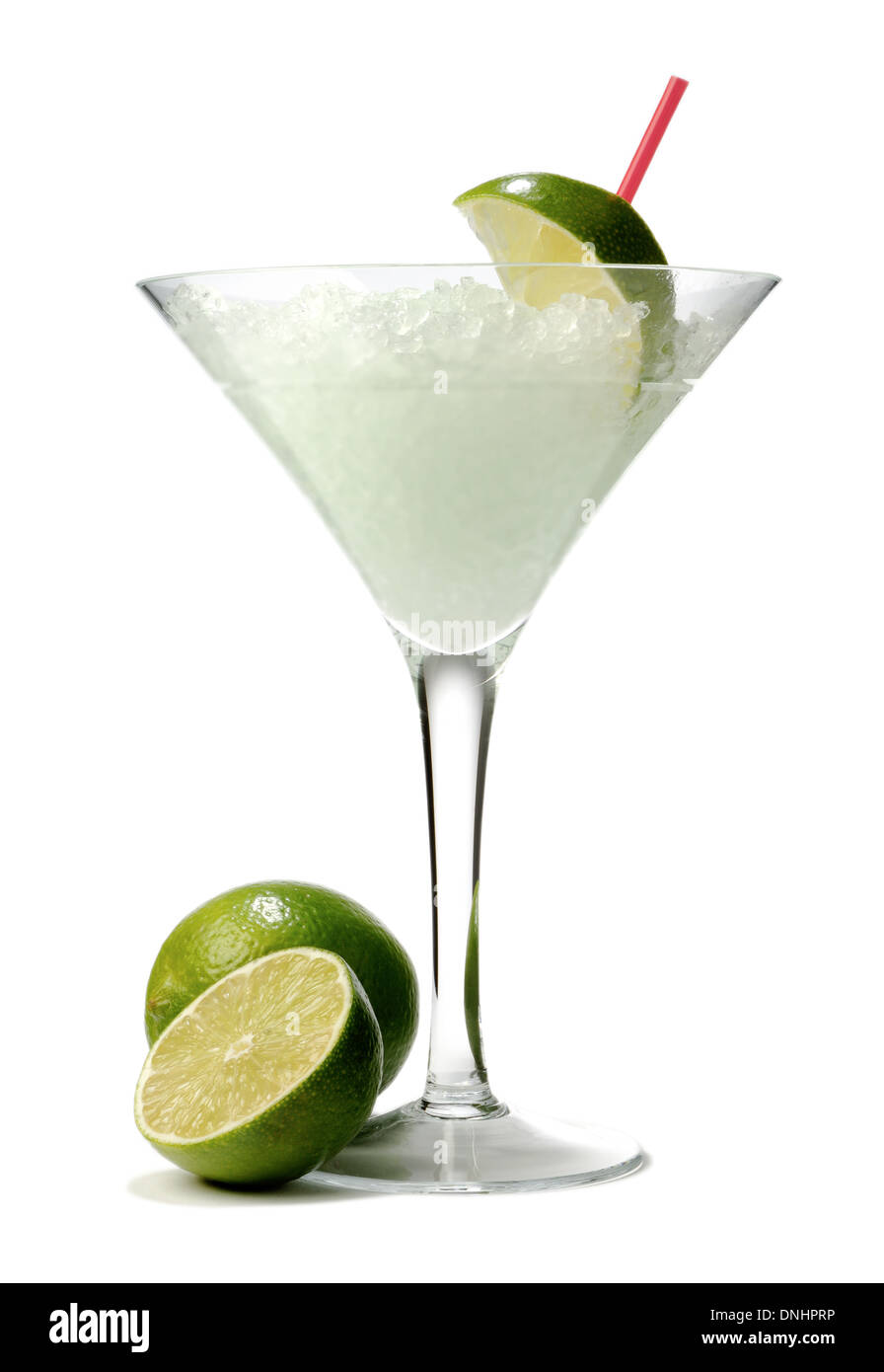 A cocktail drink in a stemmed glass with a green lime garnishes. Stock Photo