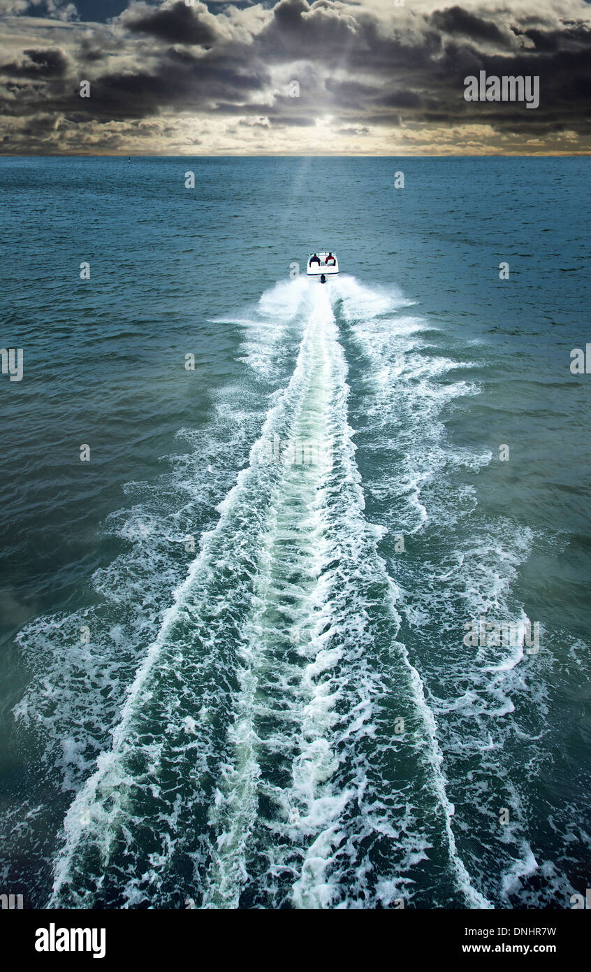 Speedboat cruising in the sea Stock Photo