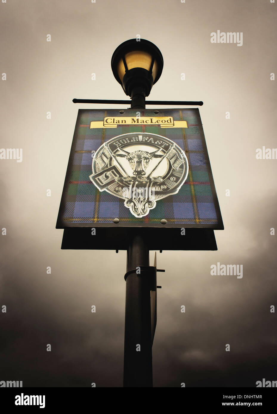 Clan MacLeod Crest on street lamp with brooding sky Stock Photo