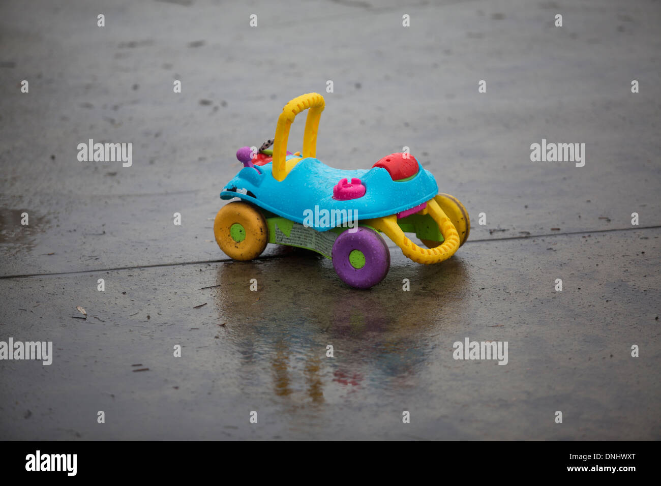Toy buggy on the wet pavement. Stock Photo