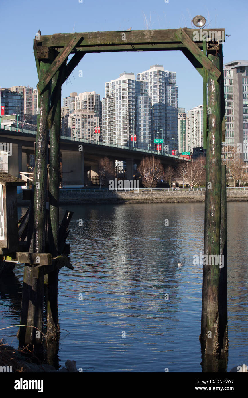 Vancouver buildings near Cambie Bridge framed by a wooden structure. Stock Photo