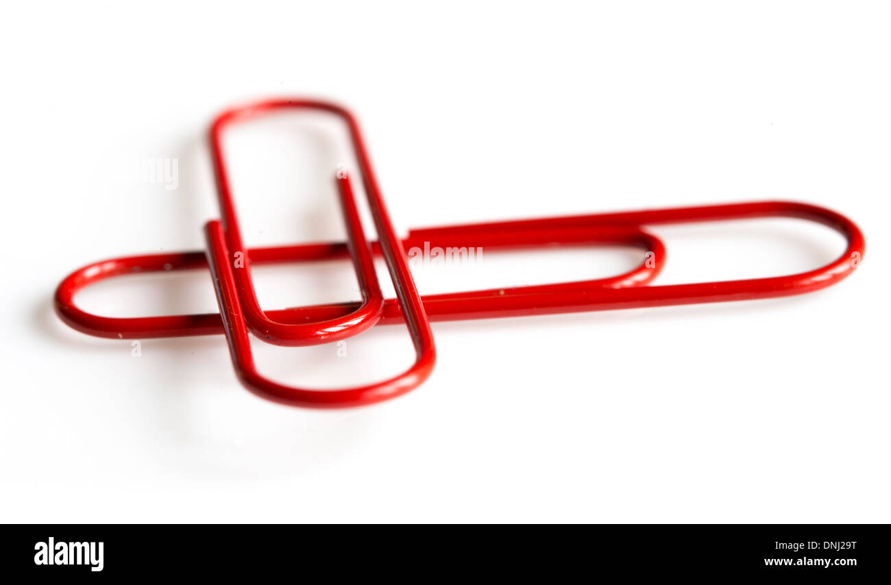 Two red paper clips, artfully arranged Stock Photo