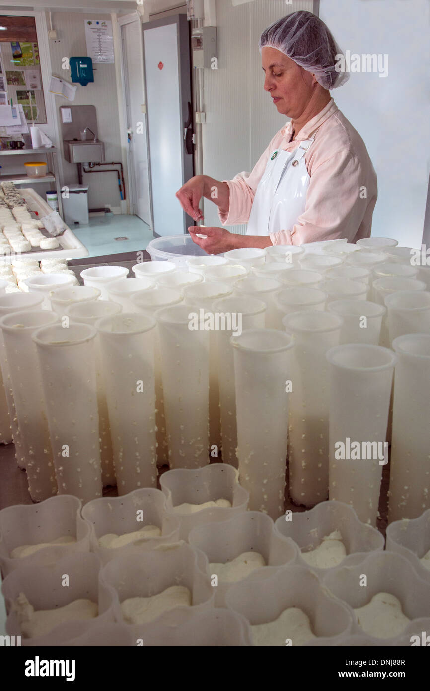 SYLVIE LHOSTE, GOAT FARMER AND CHEESEMAKER, SALTING THE CHEESES