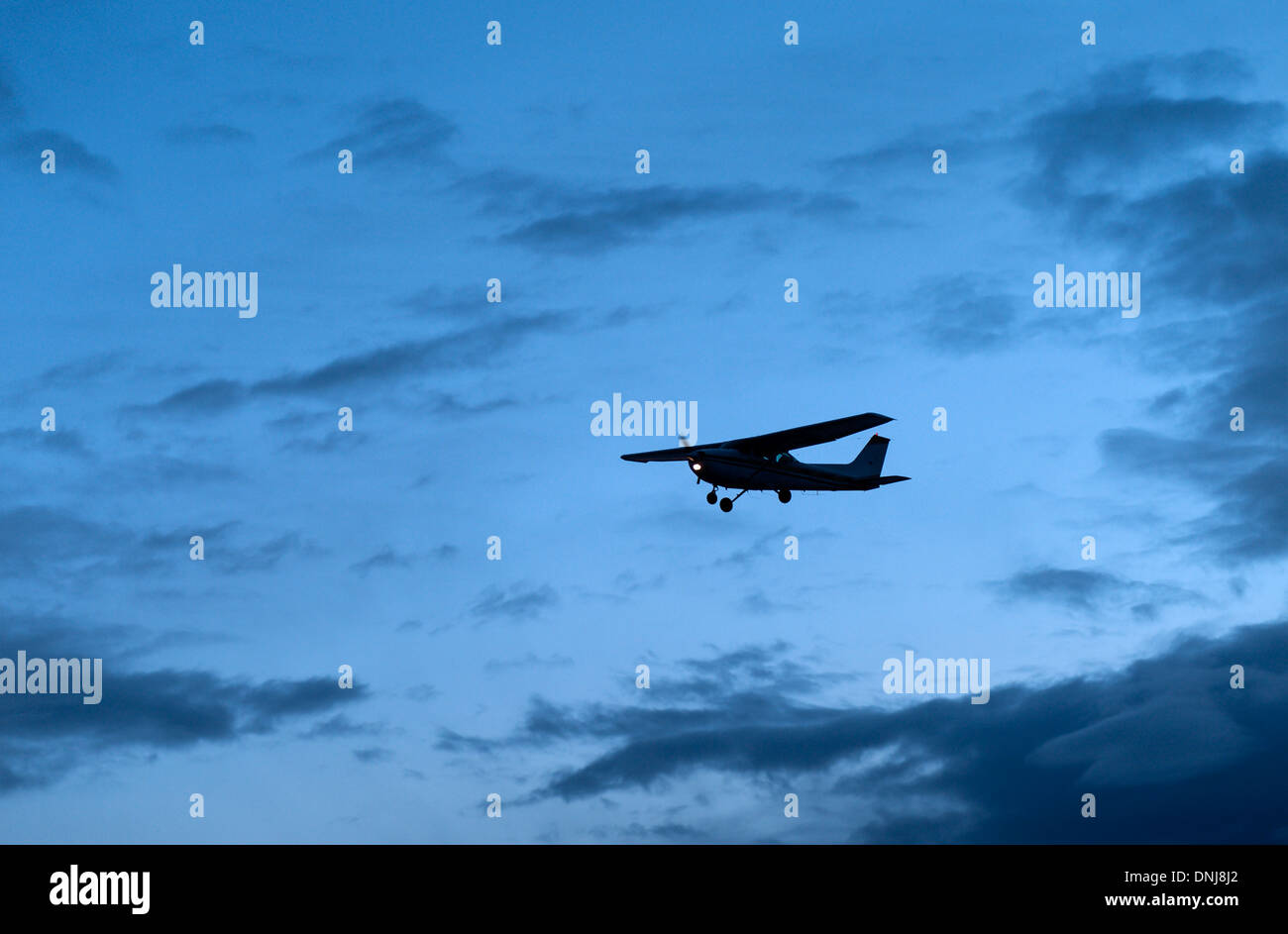 Small jet airlpane in flight. Stock Photo