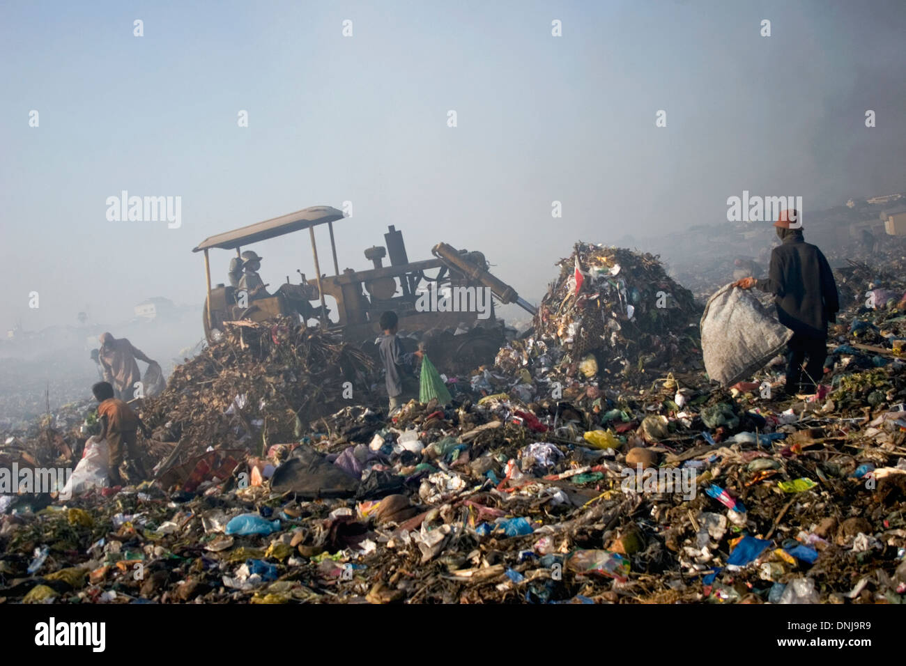 Scavengers are collecting recyclable material at the Stung Meanchey Landfill in Phnom Penh, Cambodia. Stock Photo