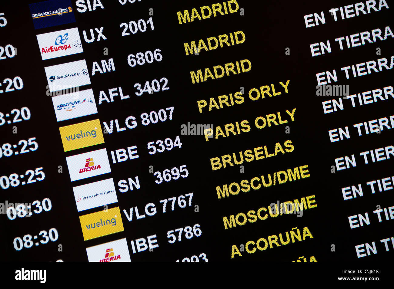 Flight status display in airport terminal, Barcelona, Spain Stock Photo