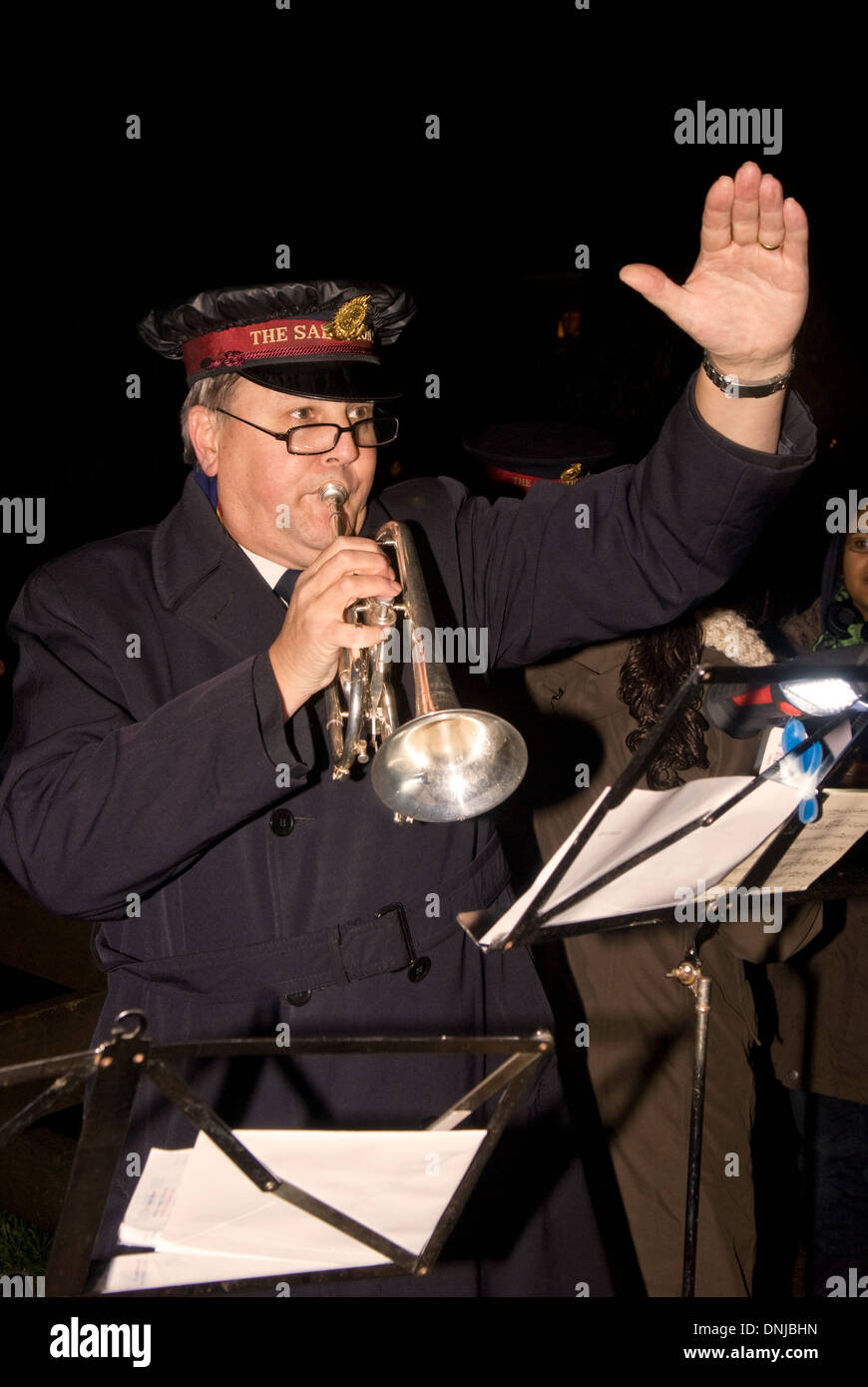 Salvation Army Band playing for local residents singing christmas carols outdoors, Clanfield, Hampshire, UK. Stock Photo