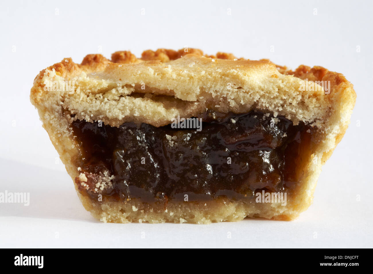 Christmas mince pie cut in half isolated on white background Stock ...
