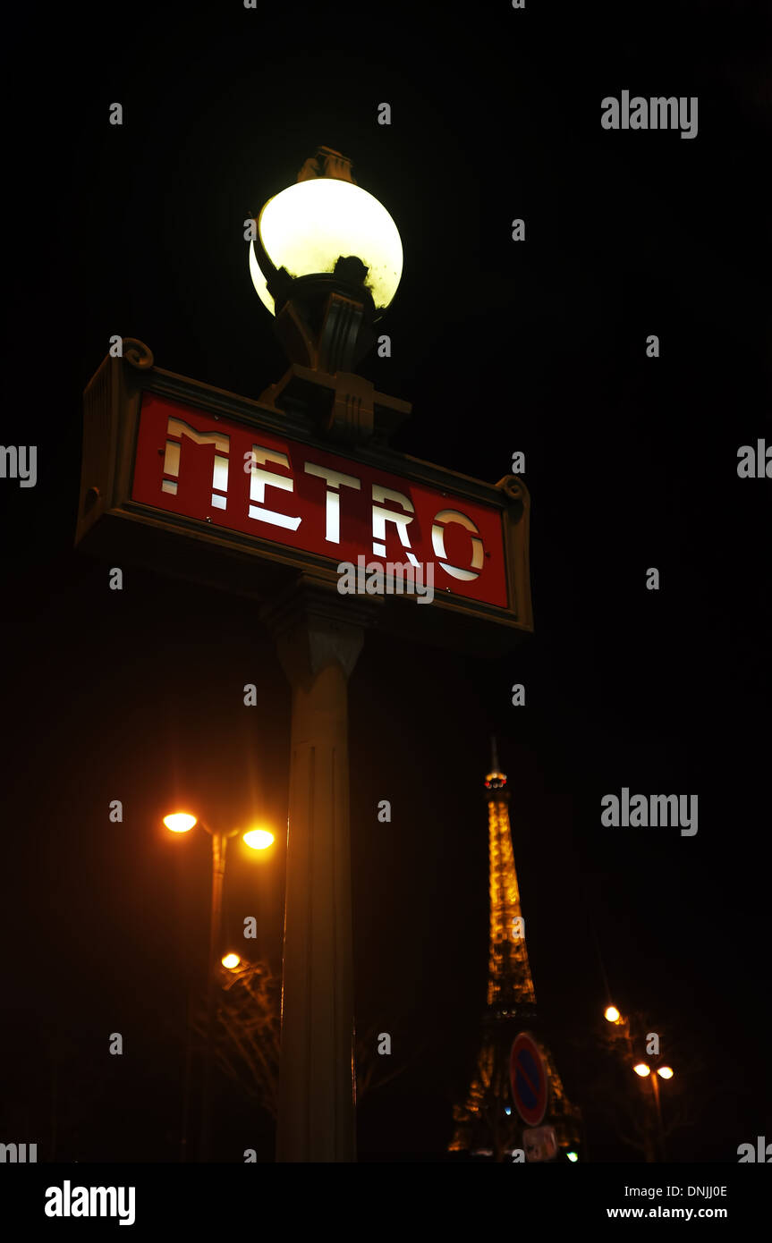 Paris metro and Eiffel Tower at night Stock Photo