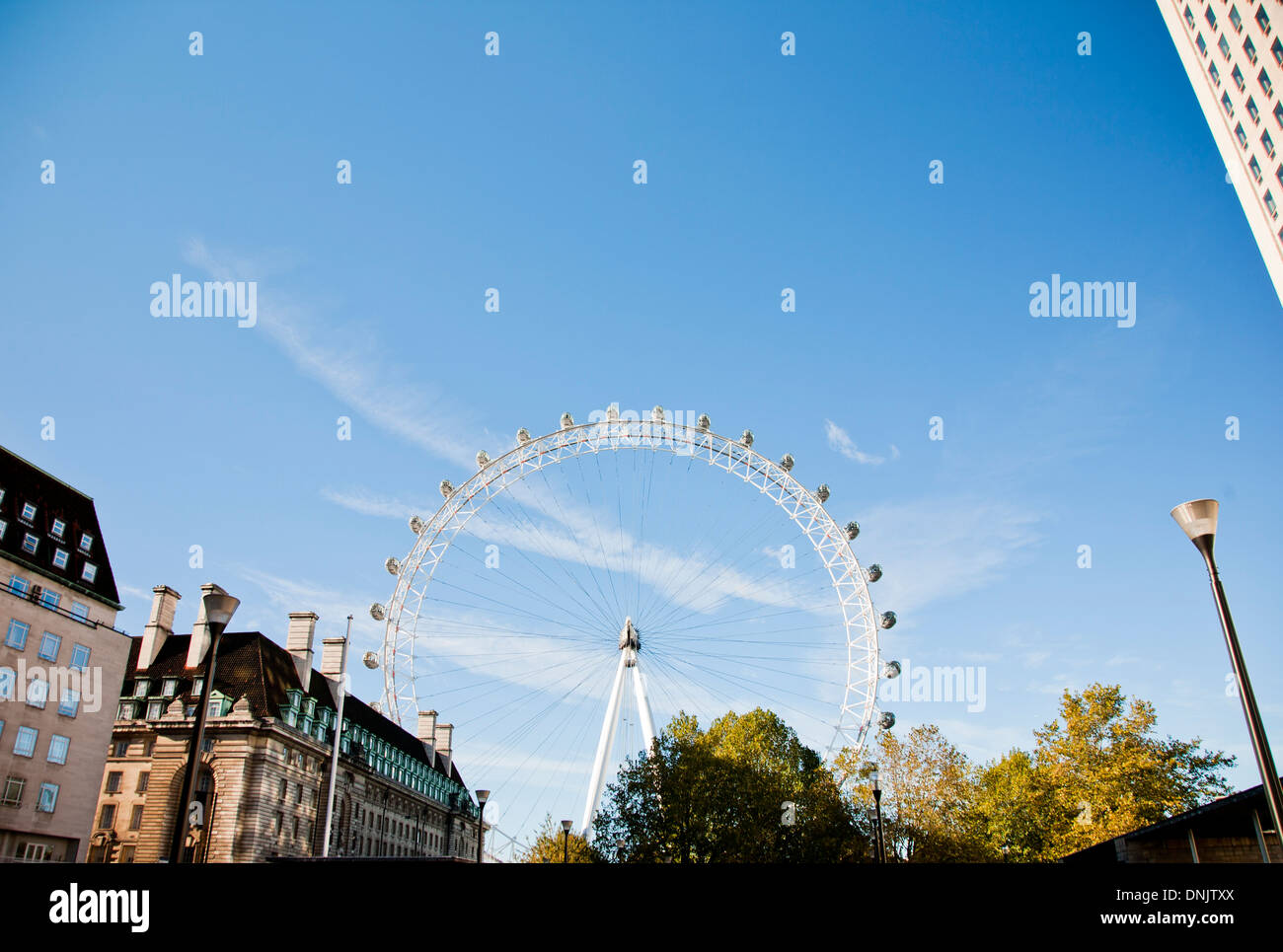View of the London Eye,  Tourist Attraction,  with city buildings, London, England, United Kingdom Stock Photo