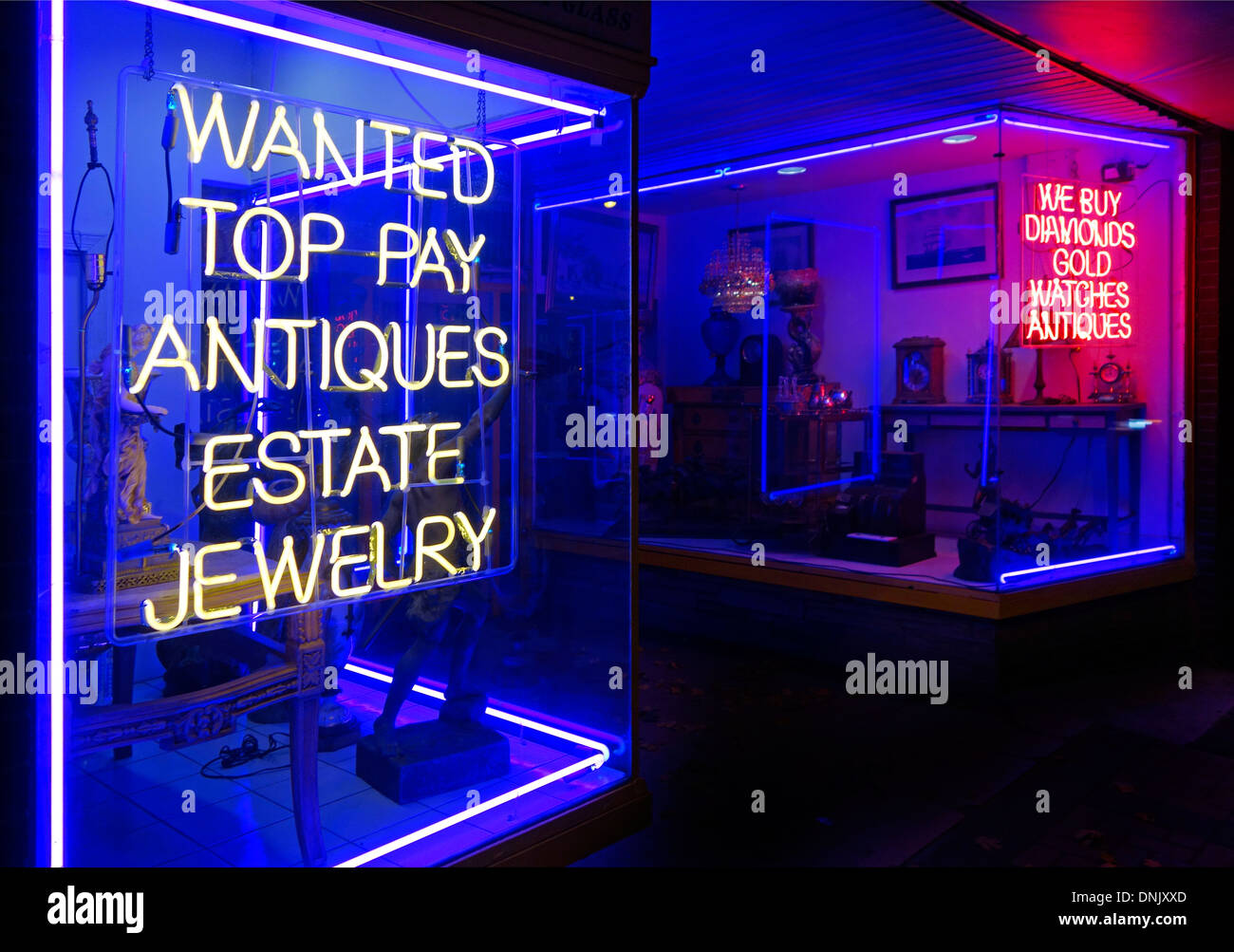 wanted top pay for antique jewelry neon sign Stock Photo