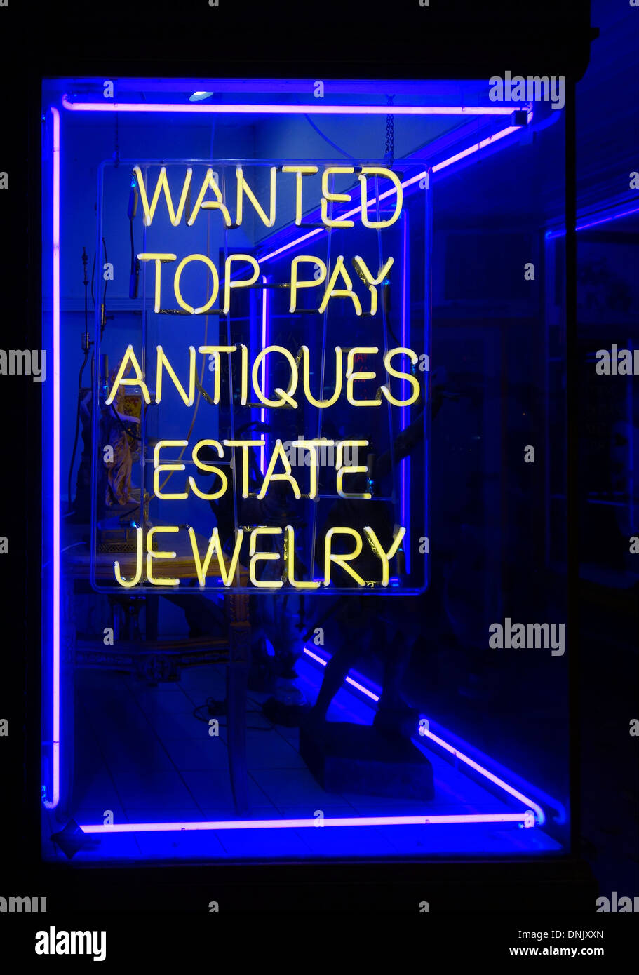 wanted top pay for antique jewelry neon sign Stock Photo