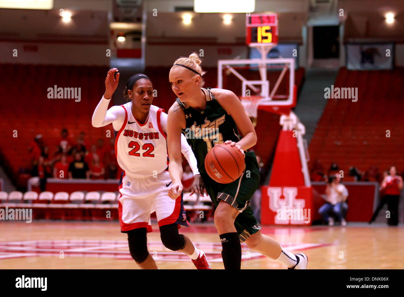 Houston, Texas, USA. 31st Dec, 2013. DEC 31 2013: University of South Florida guard Inga Orekhova #13 drives to the basket while being defended by University of Houston forward Marche' Amerson #22 during the NCAA Women's basketball game between Houston and South Florida from Hofheinz Pavilion in Houston, TX. © csm/Alamy Live News Stock Photo