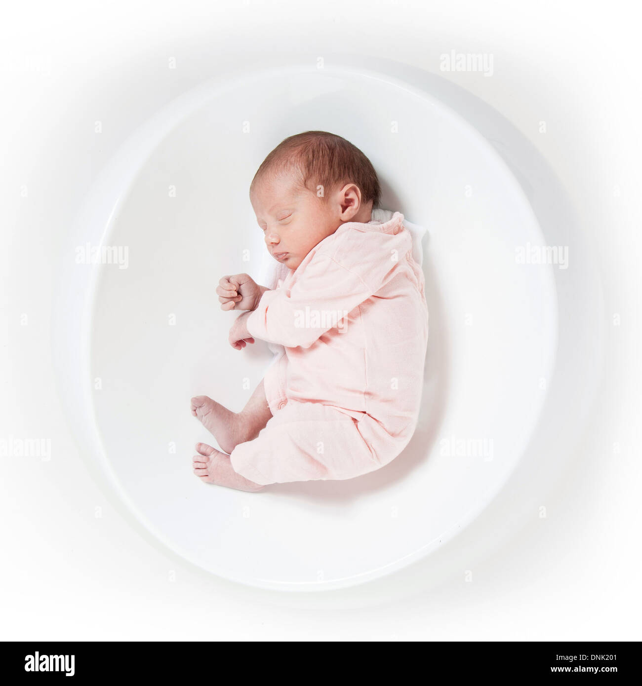 NEWBORN IN A FOETAL POSITION, THE START OF LIFE Stock Photo