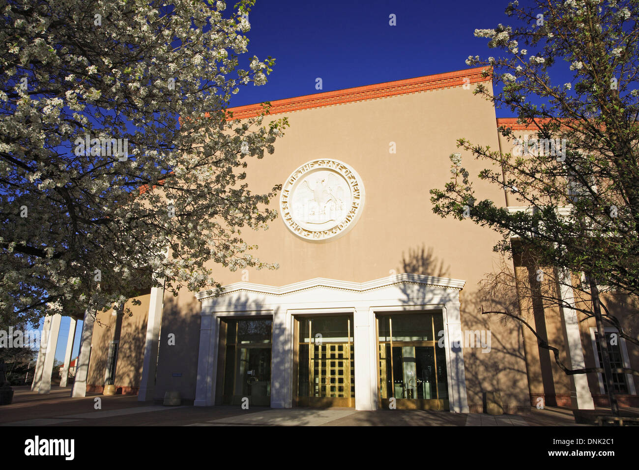 Pear trees in bloom and Roundhouse (New Mexico's capitol building