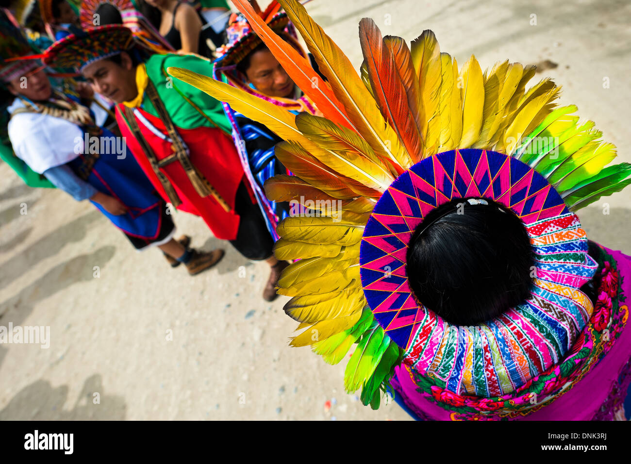 Natives of the Kamentsá and Inga tribes, wearing colorful headgears, take part in the Carnival in Sibundoy, Colombia. Stock Photo