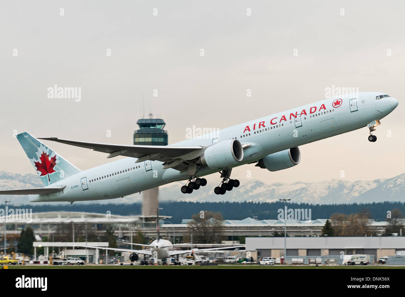 An Air Canada Boeing 777-300ER (C-FIUV) takes off from Vancouver International Airport, Canada Stock Photo