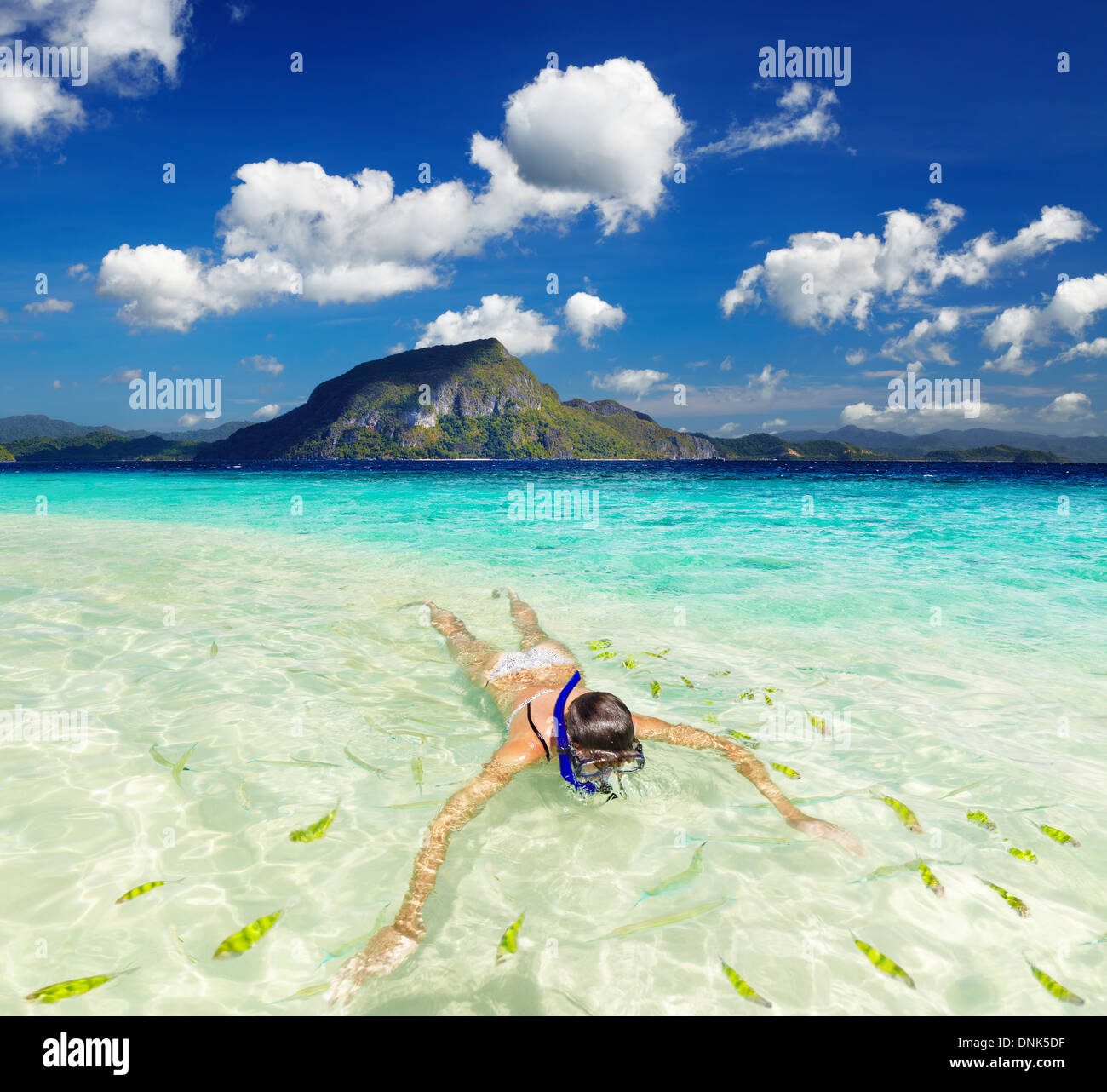 Tropical beach, woman swimming with snorkel Stock Photo