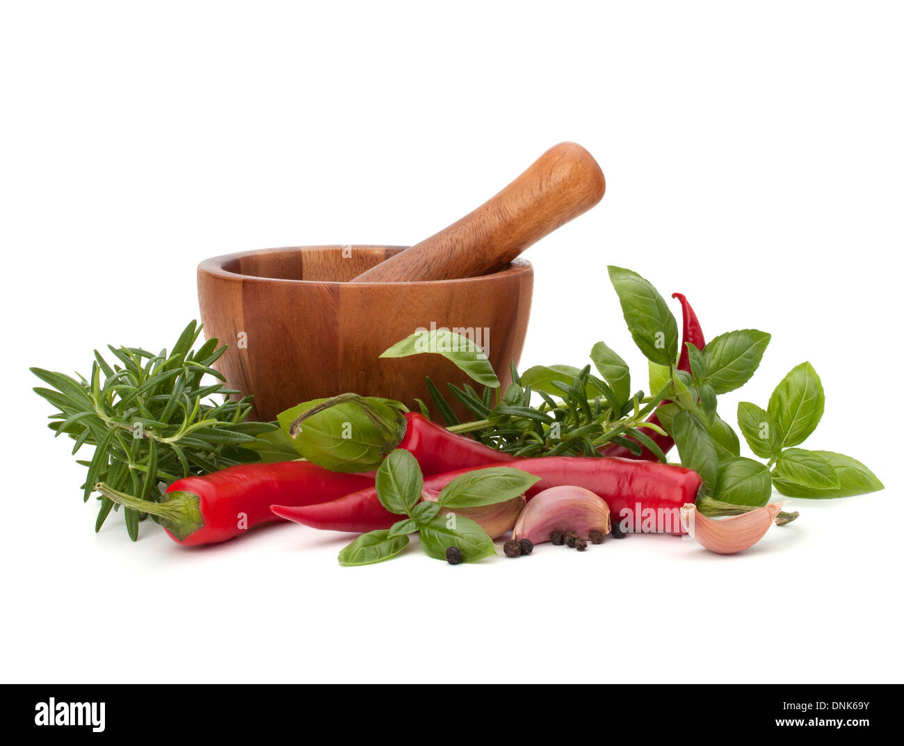 fresh flavoring herbs and spices in wooden mortar isolated on white ...
