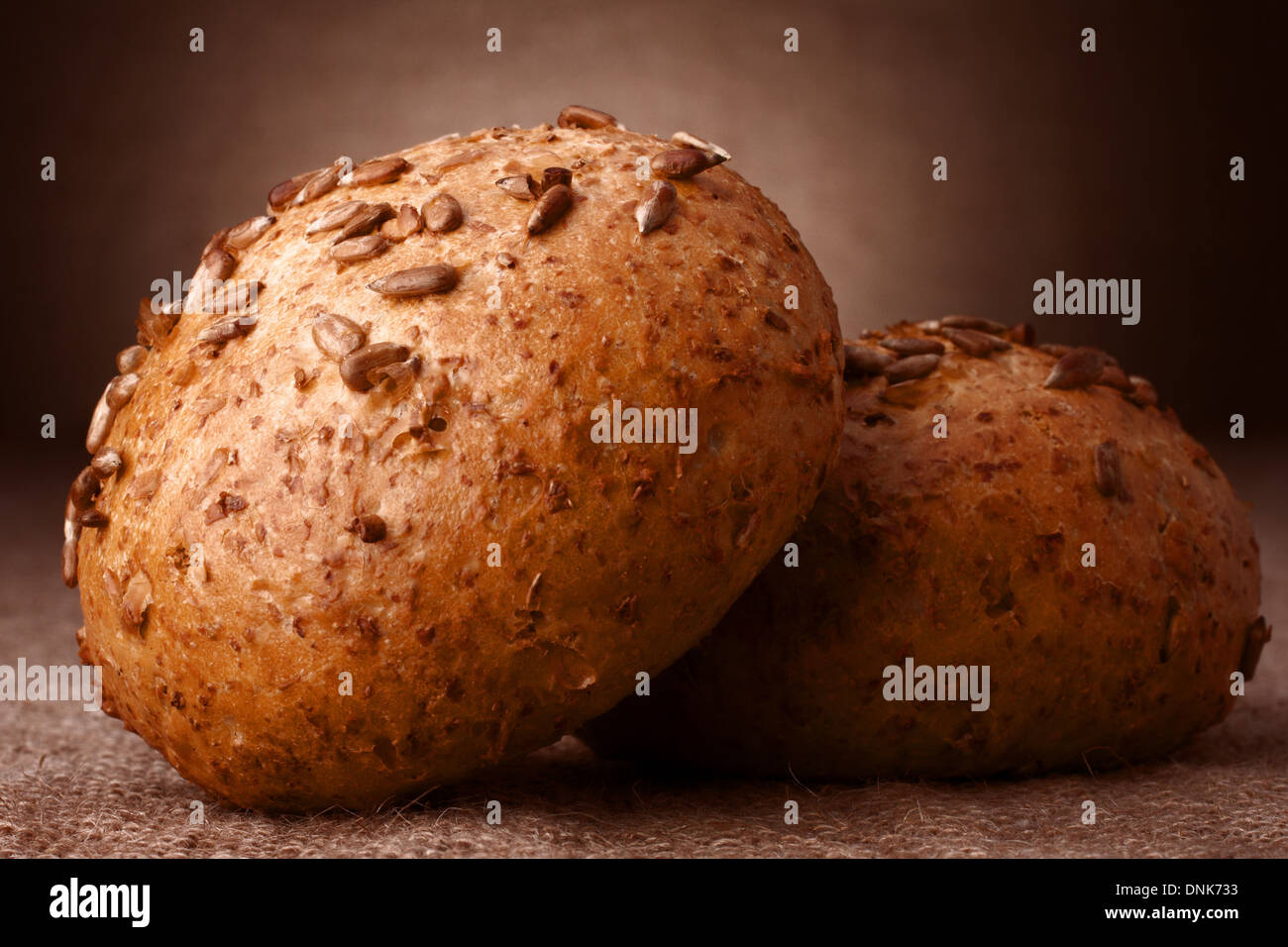 Sesame seeds buns on rustic background Stock Photo Alamy