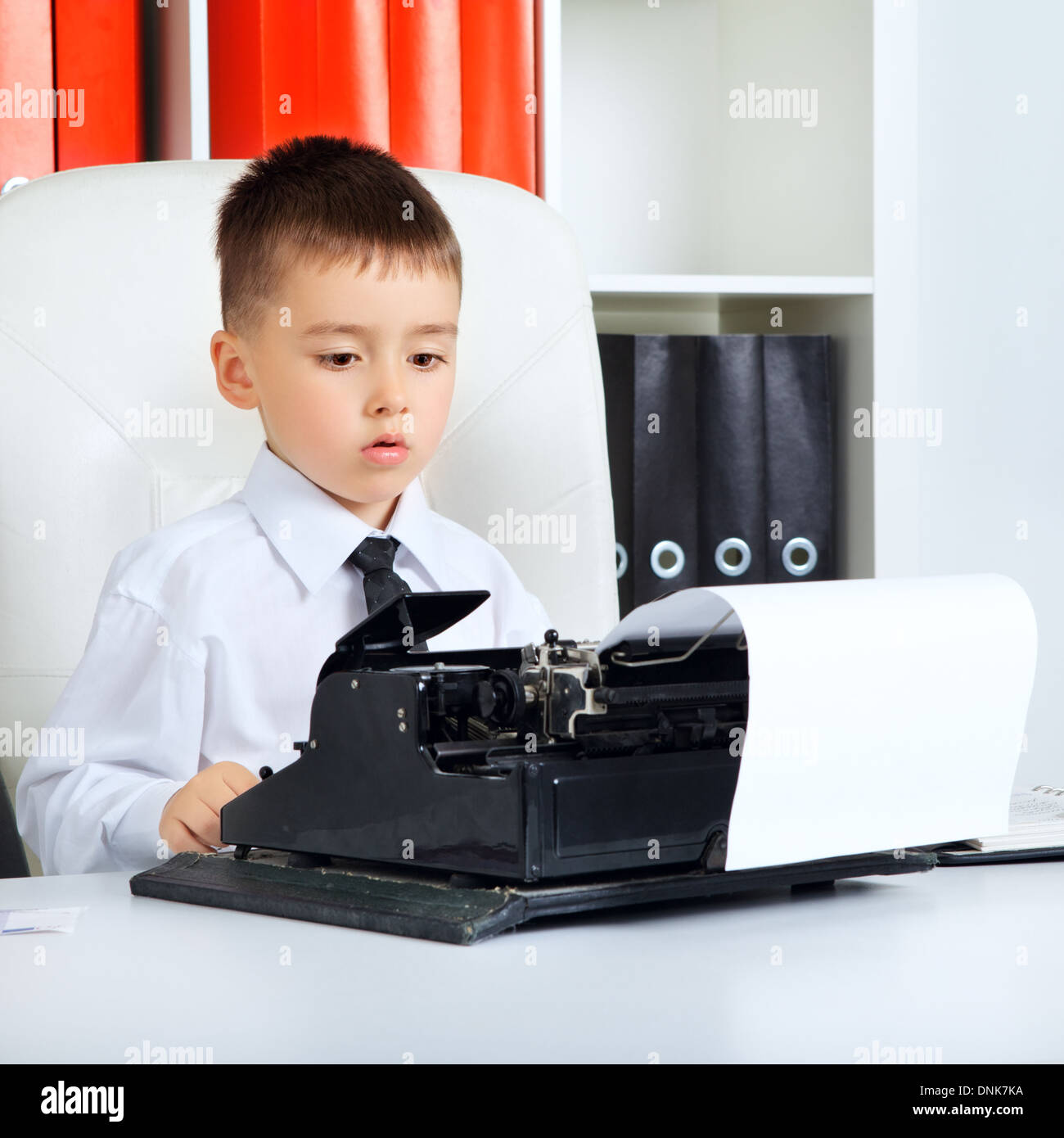 little boy as a businessman, in office Stock Photo - Alamy