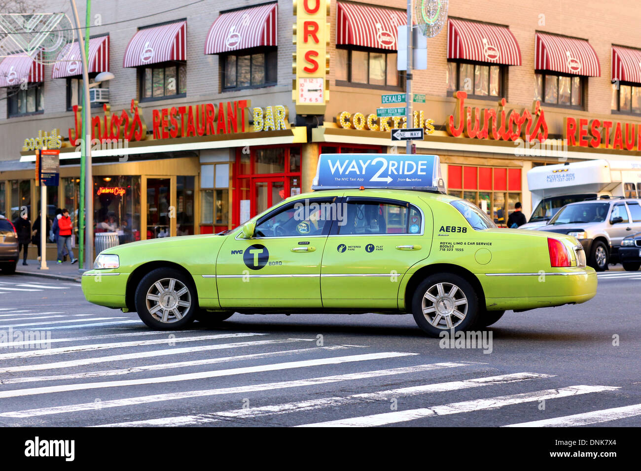 A green NYC Boro Taxi on the streets of Brooklyn. Stock Photo