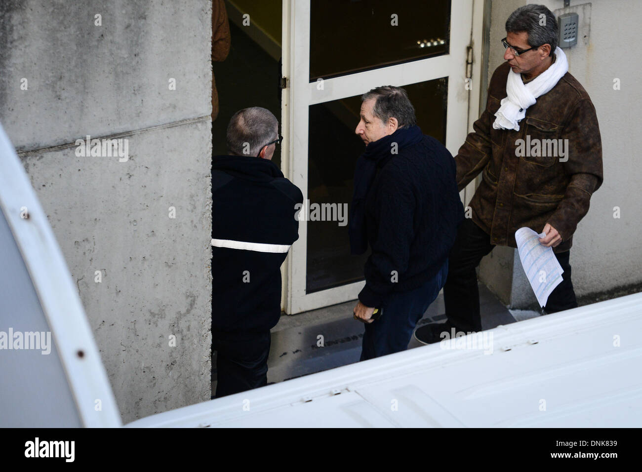 Grenoble, France. 01st Jan, 2014. President of the Federation Internationale de l'Automobile (F.I.A.) Jean Todt (C) arrives at the 'Centre Hospitalier Universitaire' (CHU) hospital in Grenoble, France, 01 January 2014. Schumacher manager Kehm says Schumacher' s condition is stable and has not changed since doctors said he showed small signs of improvement. Schumacher, who turns 45 on Friday, suffered critical head injuries when he fell and struck a rock Sunday while skiing. Photo: David Ebener/dpa/Alamy Live News Stock Photo